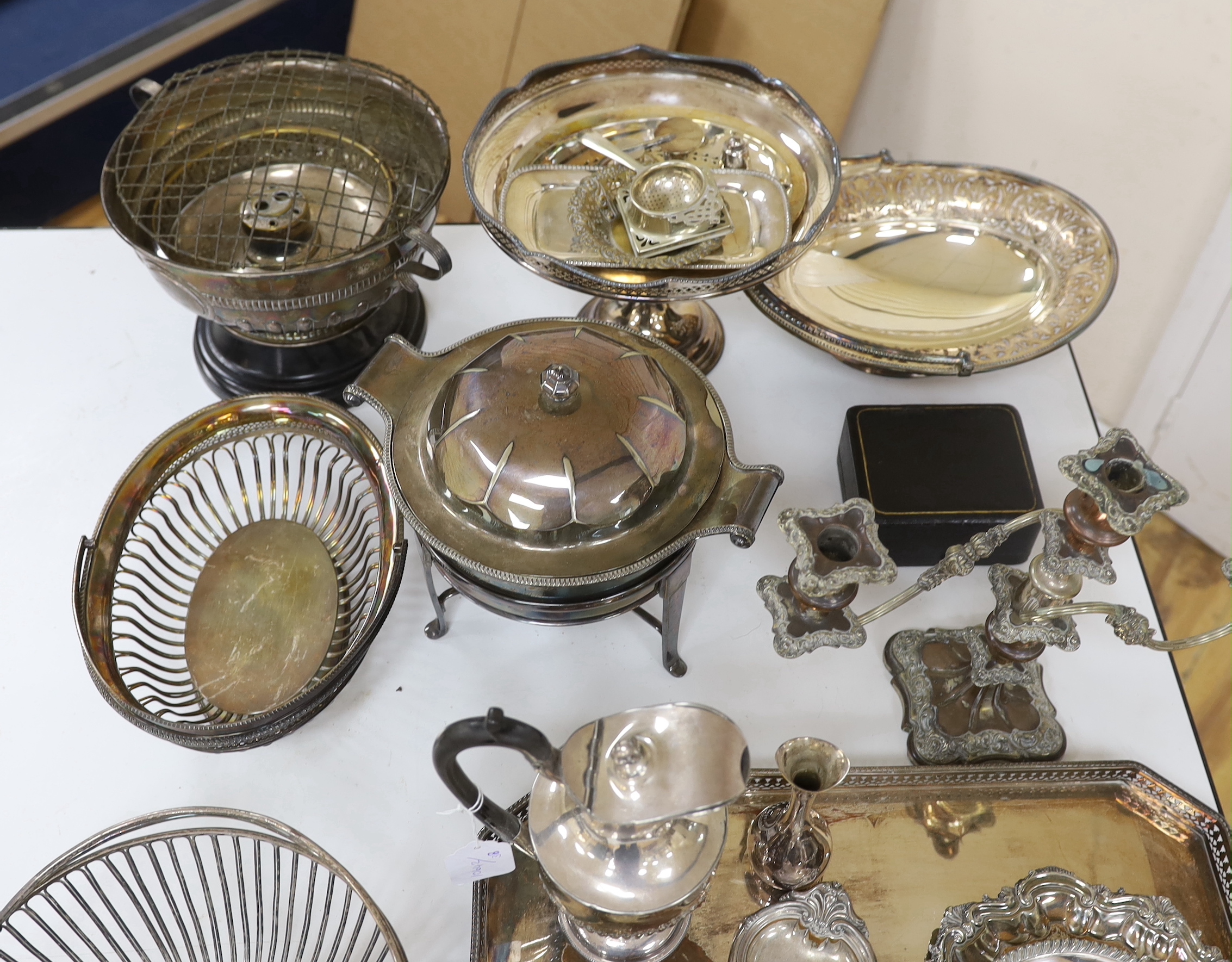 A quantity of mixed plate including a tray two baskets, candelabra , Tarzan etc